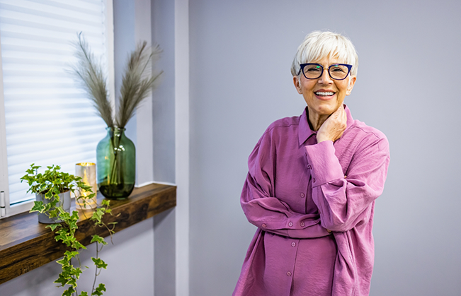 Smiling woman in a purple blouse