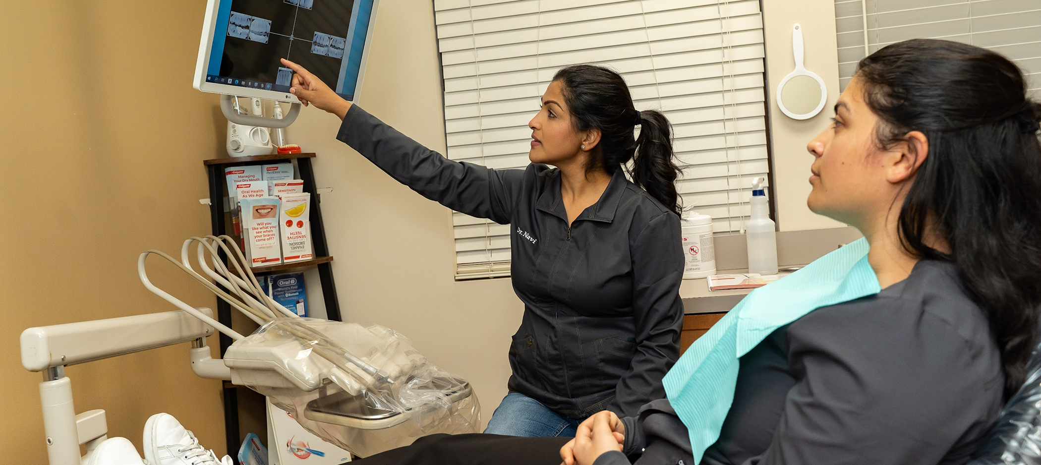 Dentist showing a patient an x ray of their teeth