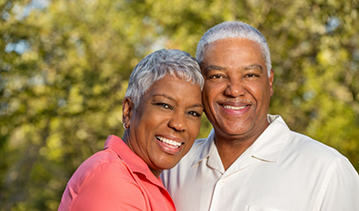 Senior couple smiling outdoors