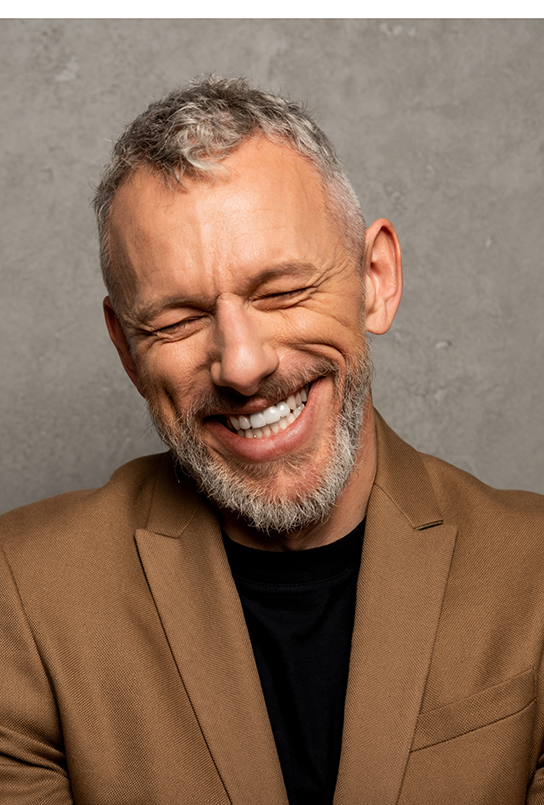 Older man grinning after root canal treatment in Maple Valley