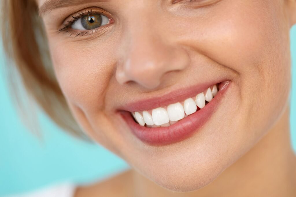 Eye-to-neck view of woman with green eyes smiling